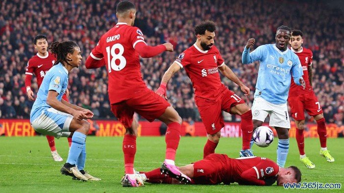 Jeremy Doku vs Alexis Mac Allister LIVERPOOL, ENGLAND - MARCH 10: Alexis Mac Allister of Liverpool reacts after a tackle by Jérémy Doku of Manchester City during the Premier League match between Liverpool FC and Manchester City at Anfield on March 10, 2024 in Liverpool, England.(Photo by Robbie Jay Barratt - AMA/Getty Images)